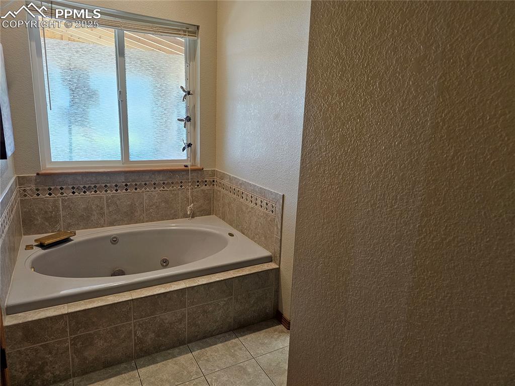 Image 15 of 44: Master Bathroom with a whirlpool tub