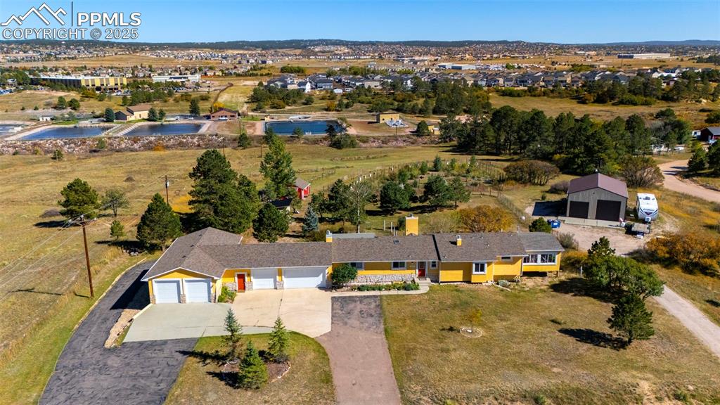 Image 36 of 44: Aerial view of property and surrounding area