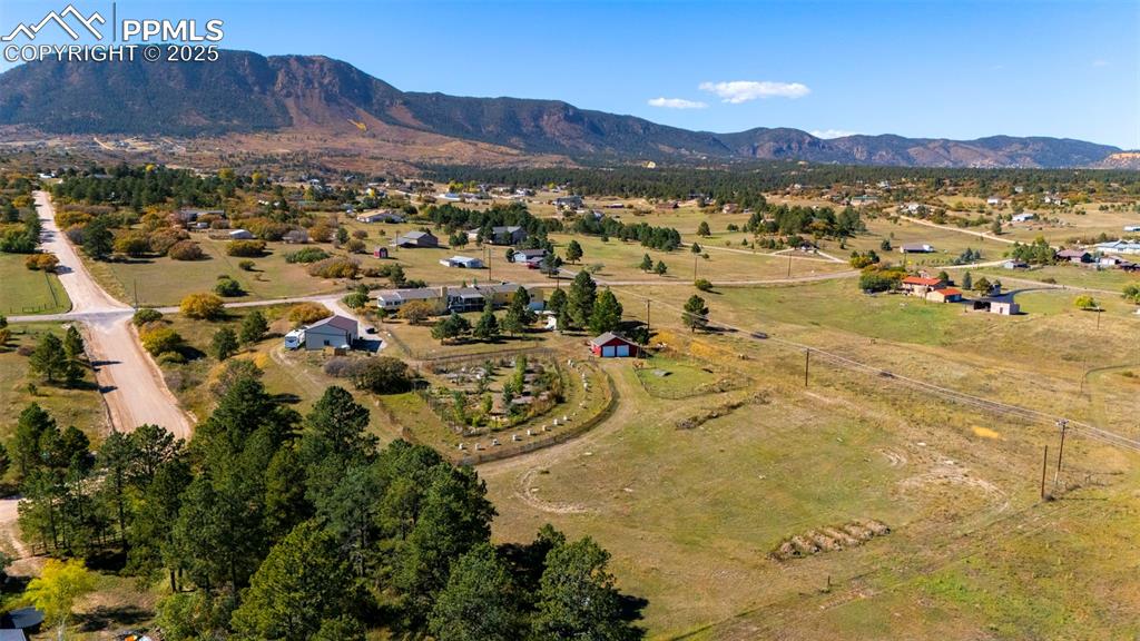 Image 40 of 44: Aerial view of property and surrounding area featuring rural landscape and 