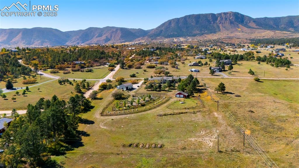 Image 41 of 44: Aerial view of property and surrounding area featuring rural landscape and 