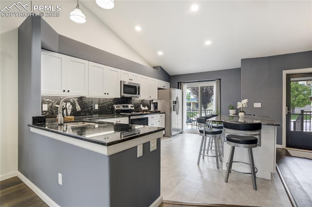 Image 12 of 43: Custom Island and luxurious stone countertops