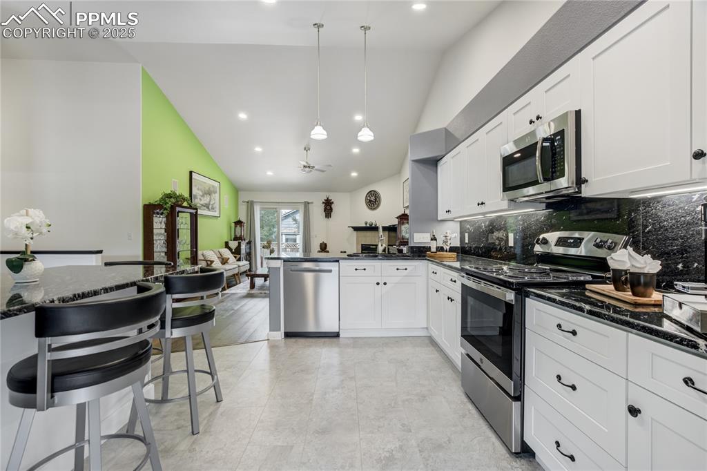 Image 16 of 43: New Cabinets with soft close draws and luxury vinyl tile 