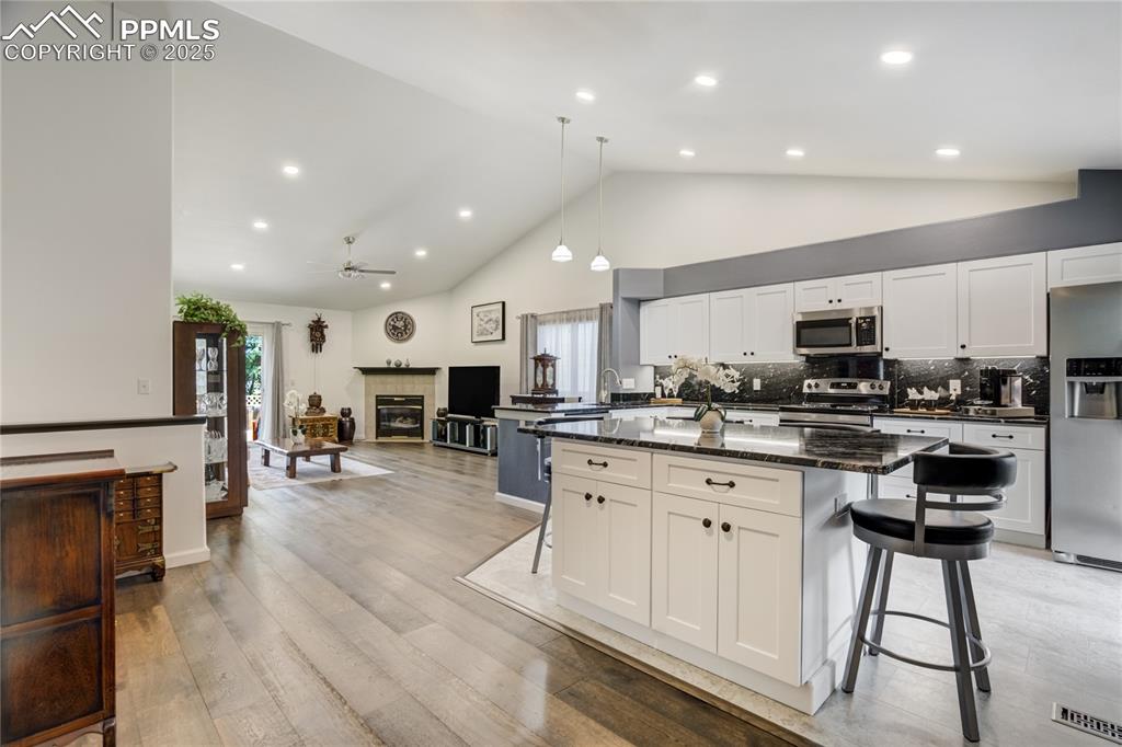 Image 17 of 43: Kitchen opens to spacious living room making it perfect for family gatherin