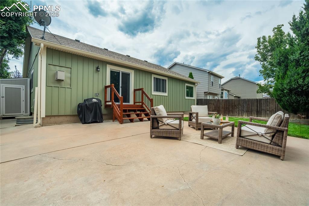 Image 38 of 43: Fully fenced back yard, large entertainment space
