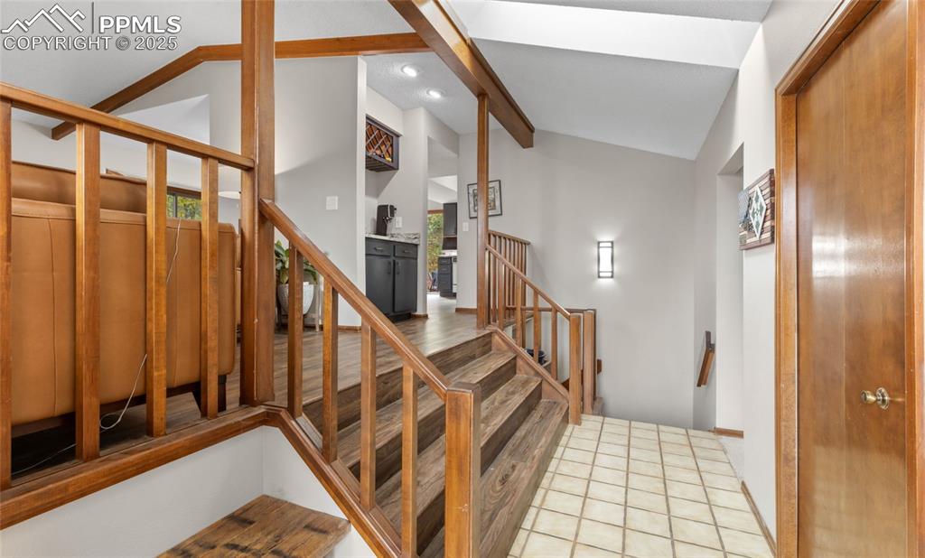 Image 8 of 21: Staircase featuring tile patterned floors and recessed lighting