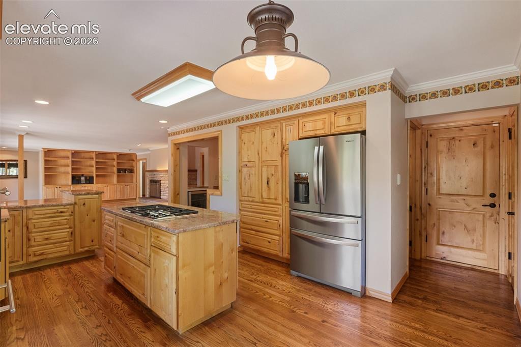 Image 11 of 47: Open floor plan between kitchen and Living Room