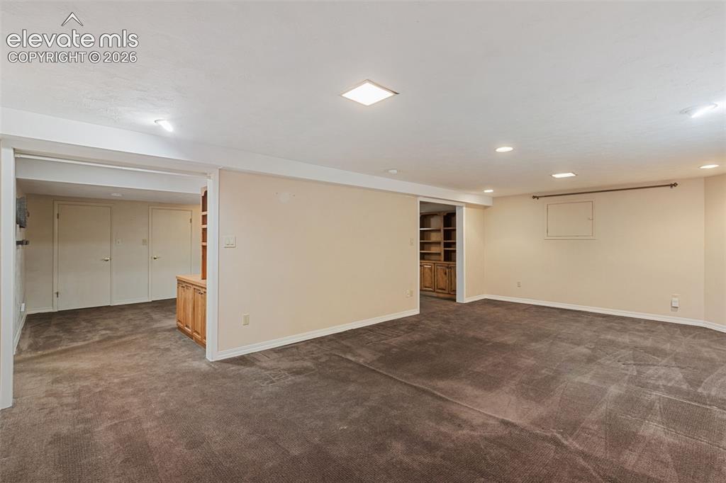 Image 35 of 47: Downstairs Family room open to office