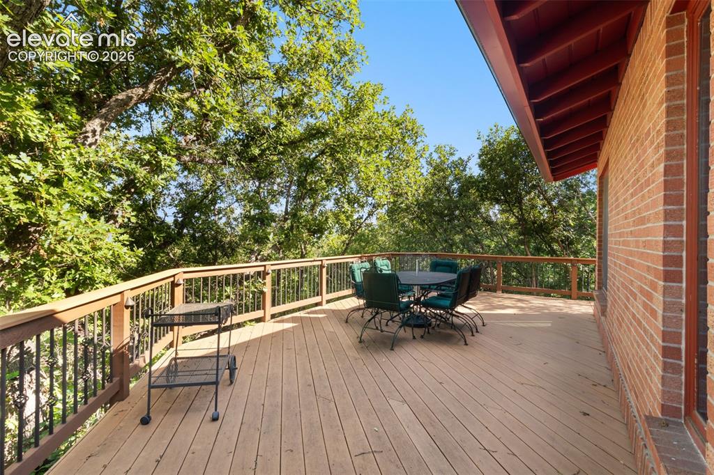 Image 40 of 47: Huge deck all along the back of the home
