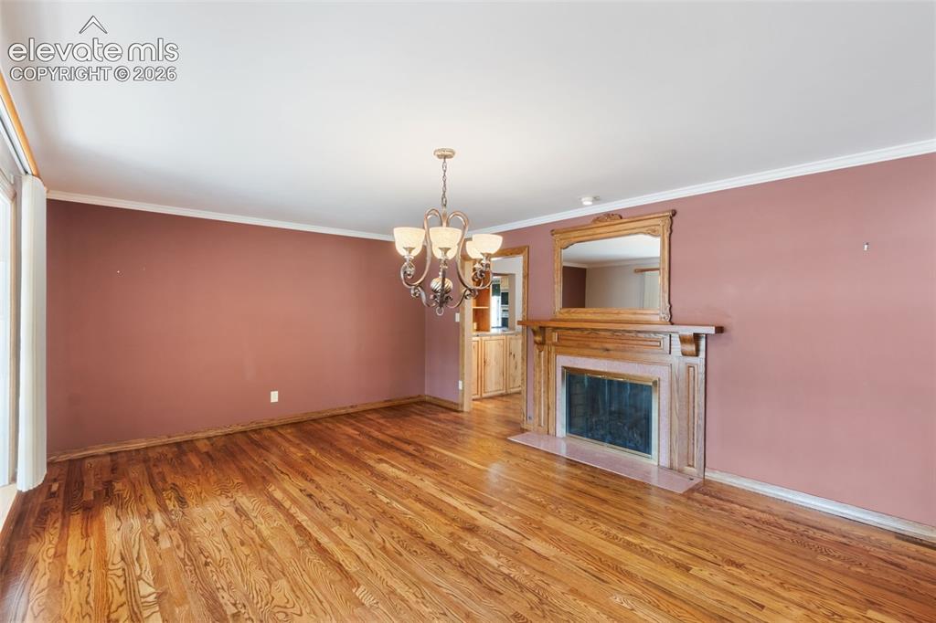 Image 5 of 47: Back to back fireplace with Living Room