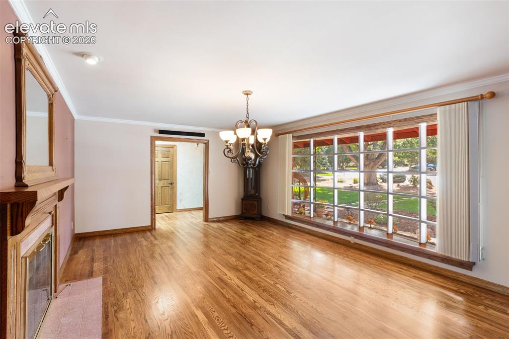 Image 6 of 47: Large bay window, fireplace 