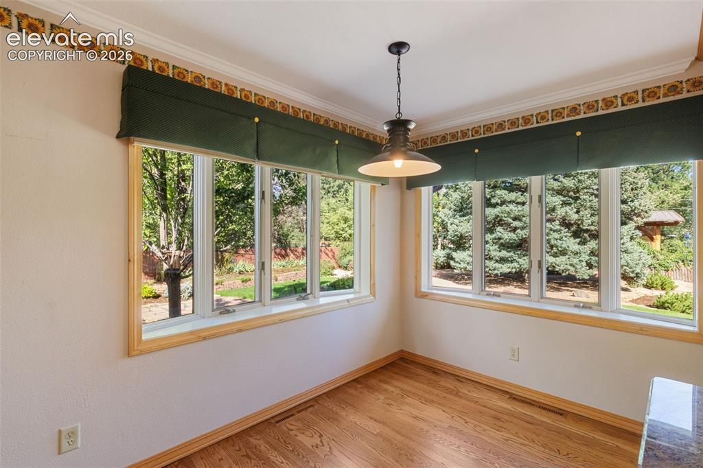 Image 8 of 47: Large bay windows in casual eating area