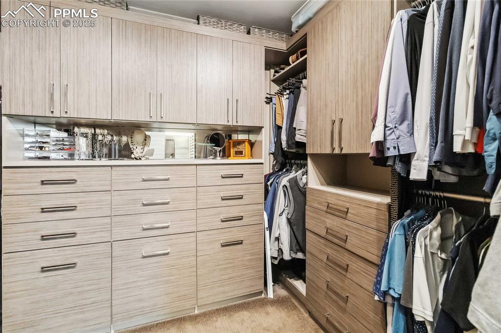 Image 23 of 48: Built in closet factory system in walk in closet!