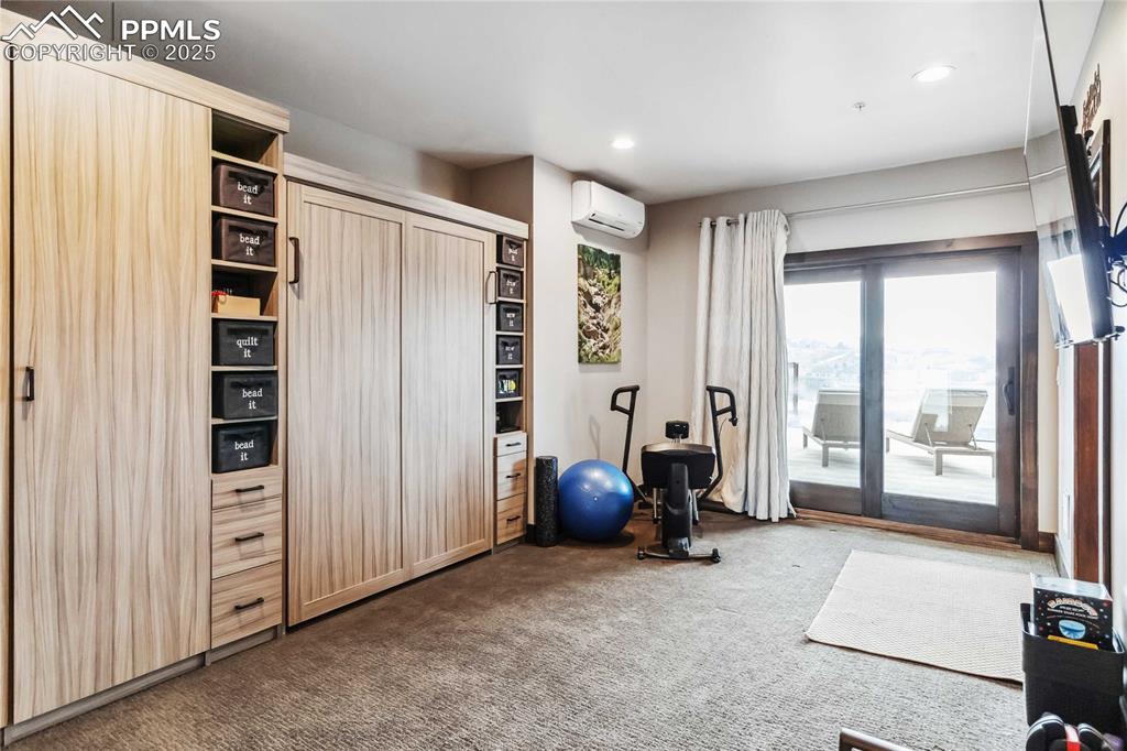 Image 40 of 48: Exercise room with a Murphy Bed!