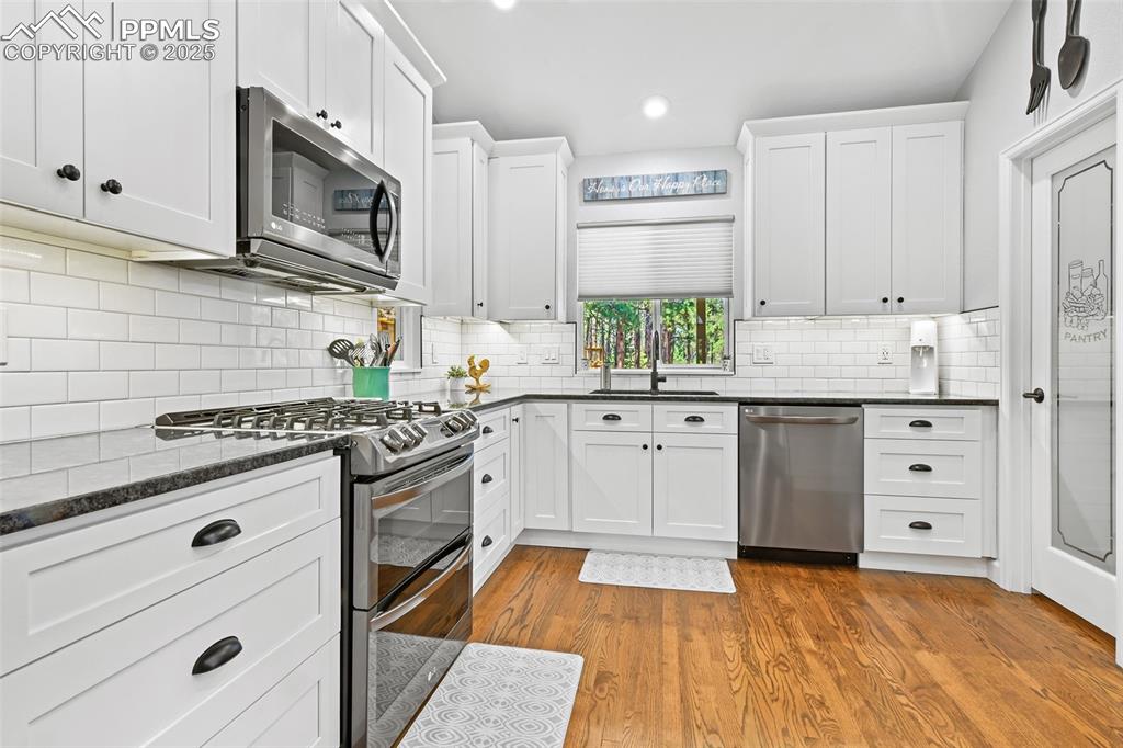 Image 11 of 50:  Walk-in pantry and extended height, soft close cabinetry