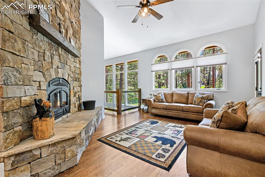 Image 16 of 50: beautiful sone hearth and custom wood mantle