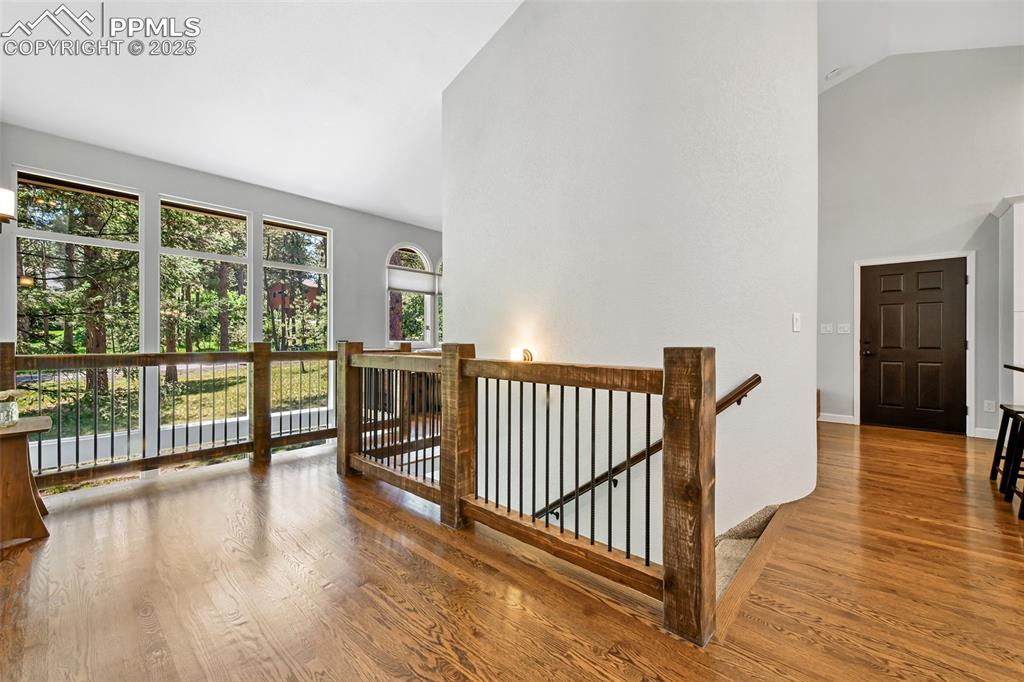 Image 26 of 50: Stunning custom wrought iron and wood railings