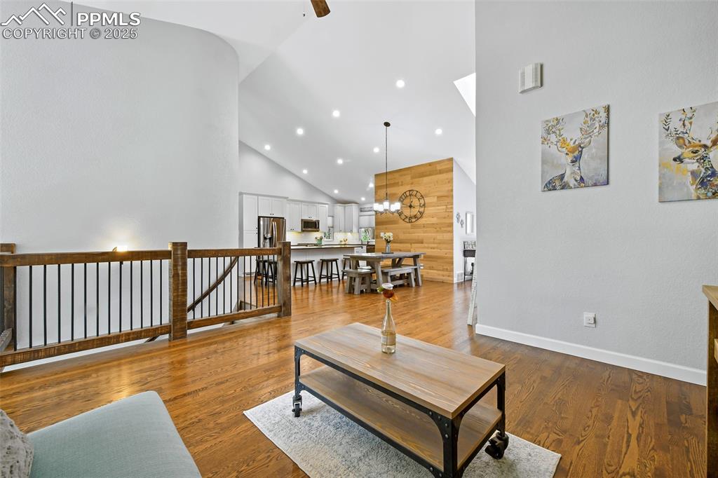 Image 6 of 50: Open flow with hardwoods throughout main level
