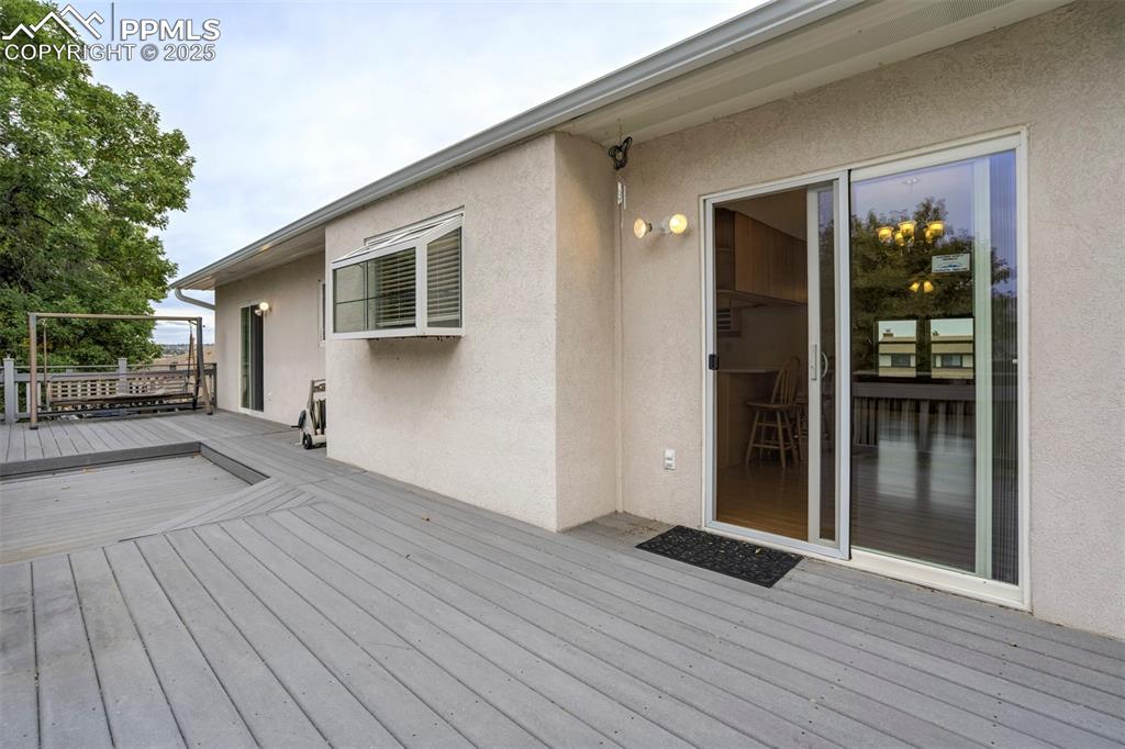 Image 22 of 26: Master and Kitchen both walk out to the deck