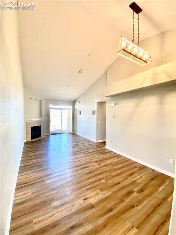 Image 8 of 21: Living room/dining area view from entry