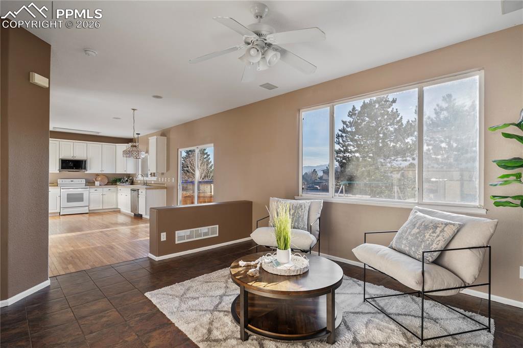 Image 10 of 28: The open concept kitchen, dining nook, and family room are desirable.