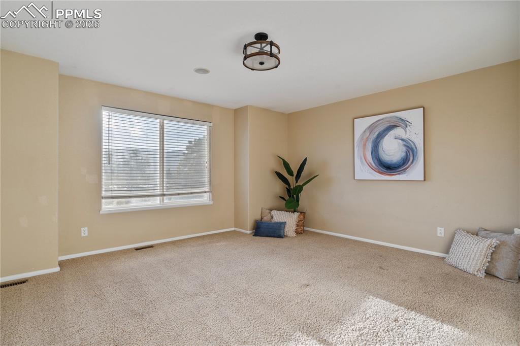 Image 18 of 28: The primary bedroom is it