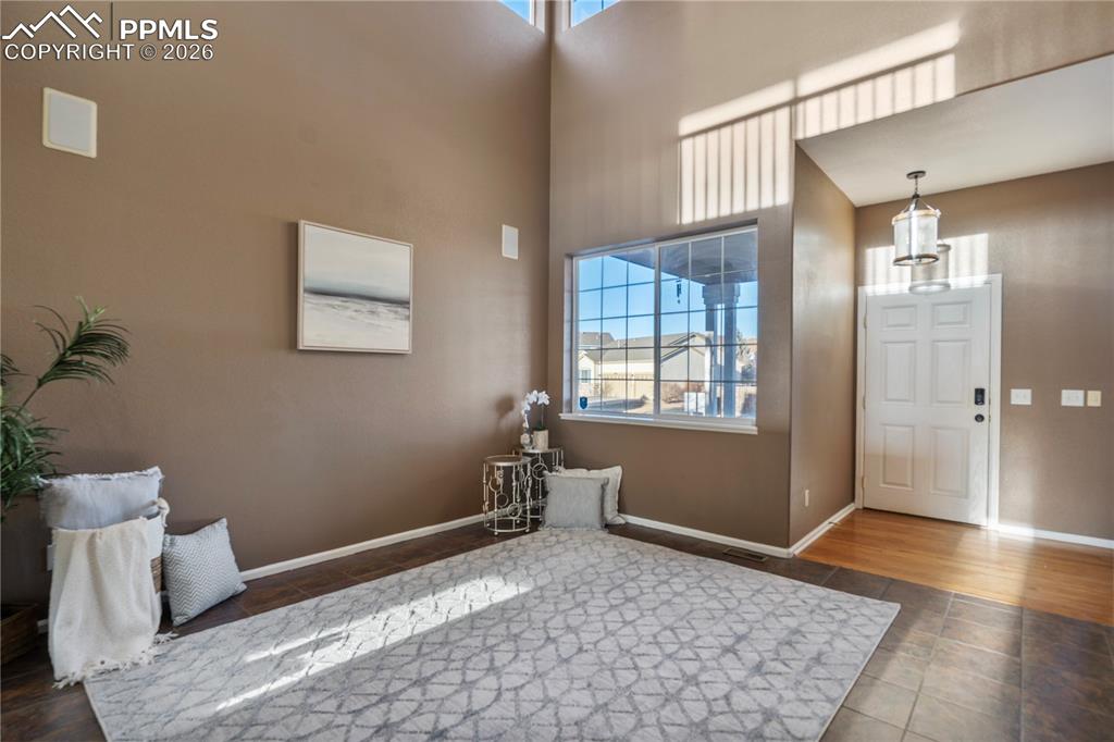 Image 2 of 28: Enter to soaring vaulted ceilings, real hardwood floors, and a dual sided f