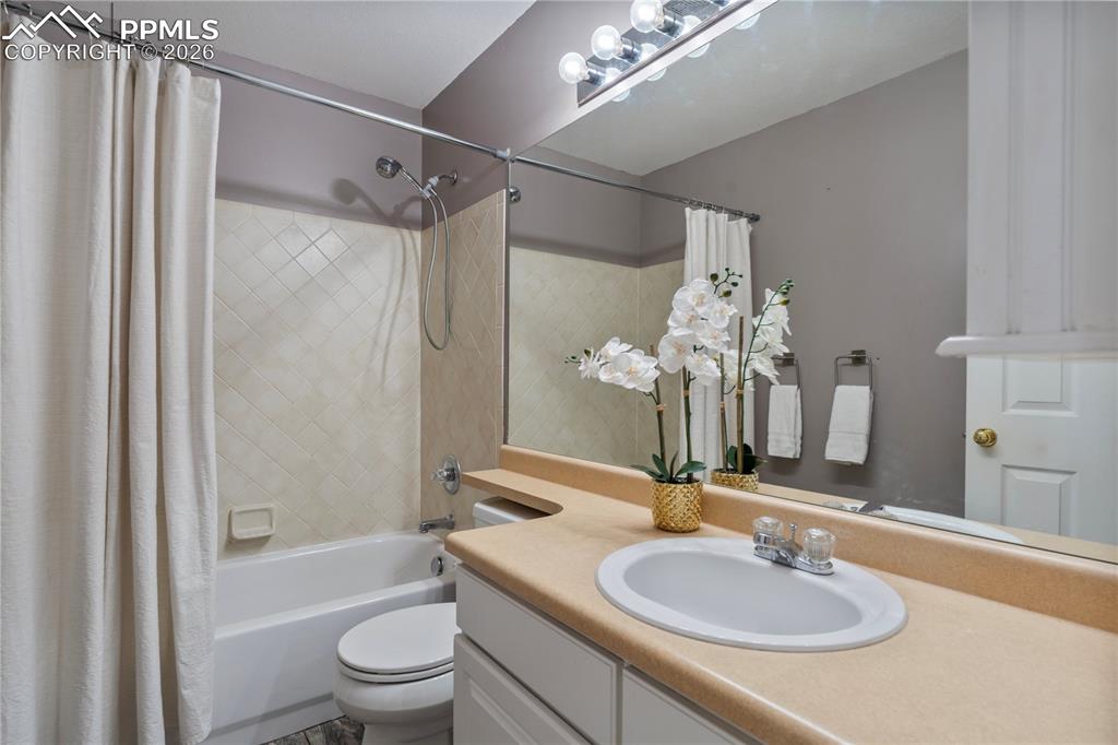 Image 21 of 28: Bright and airy upper level bathroom.