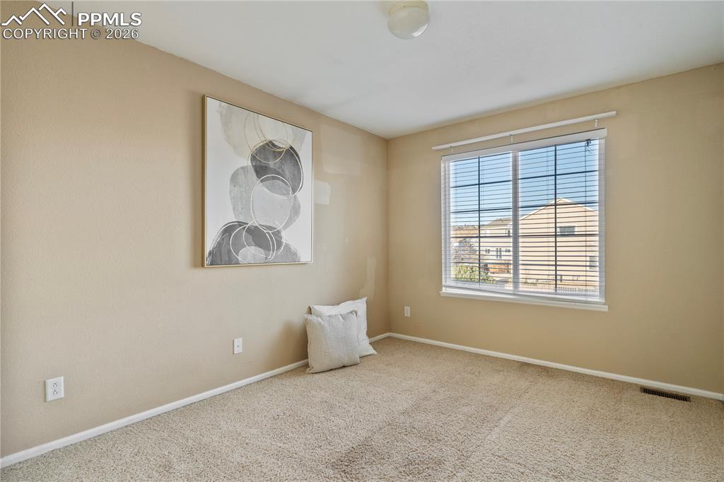 Image 22 of 28: All of the bedrooms are bright and spacious.