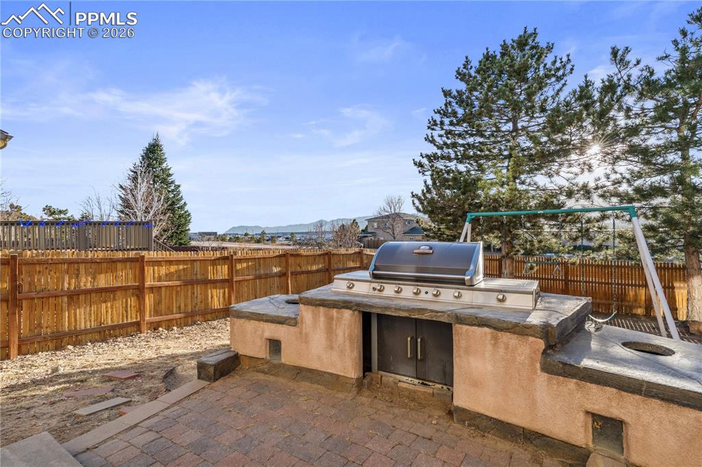 Image 5 of 28: There is an outdoor grill area to admire the Front Range views.