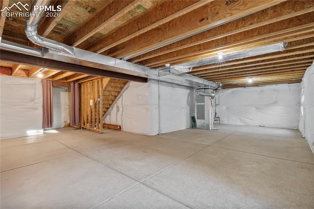 Image 7 of 28: The unfinished basement provides SO many uses or future additional living s