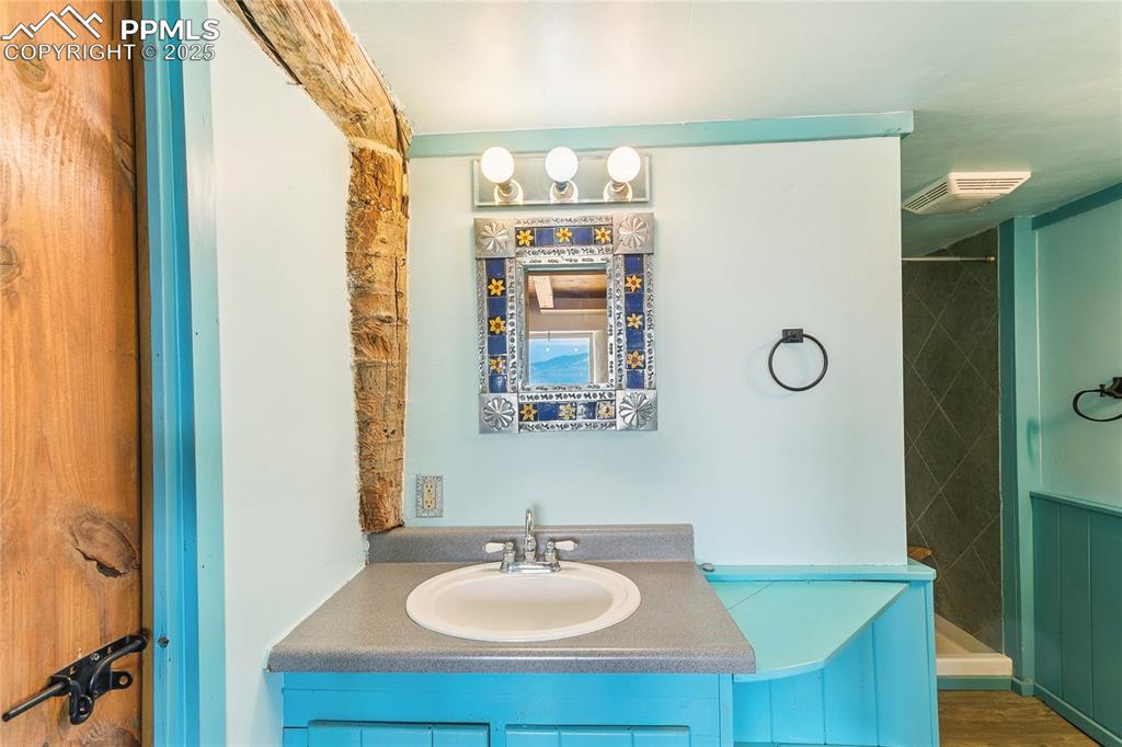 Image 27 of 50: 3/4 Bathroom featuring vanity and walk in shower