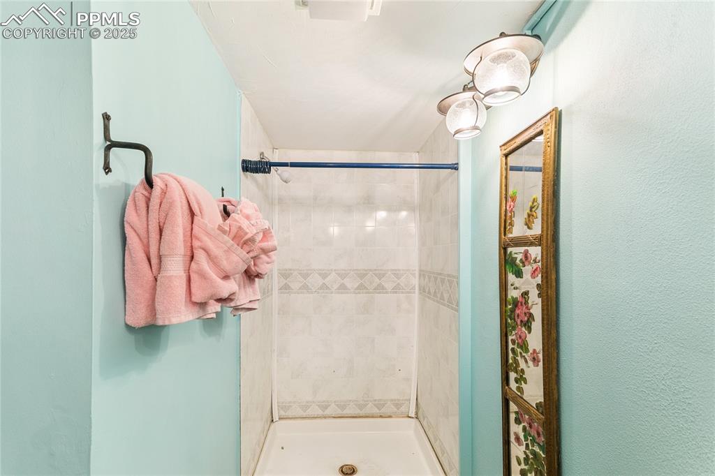 Image 37 of 50: 3/4 bath featuring a stall shower