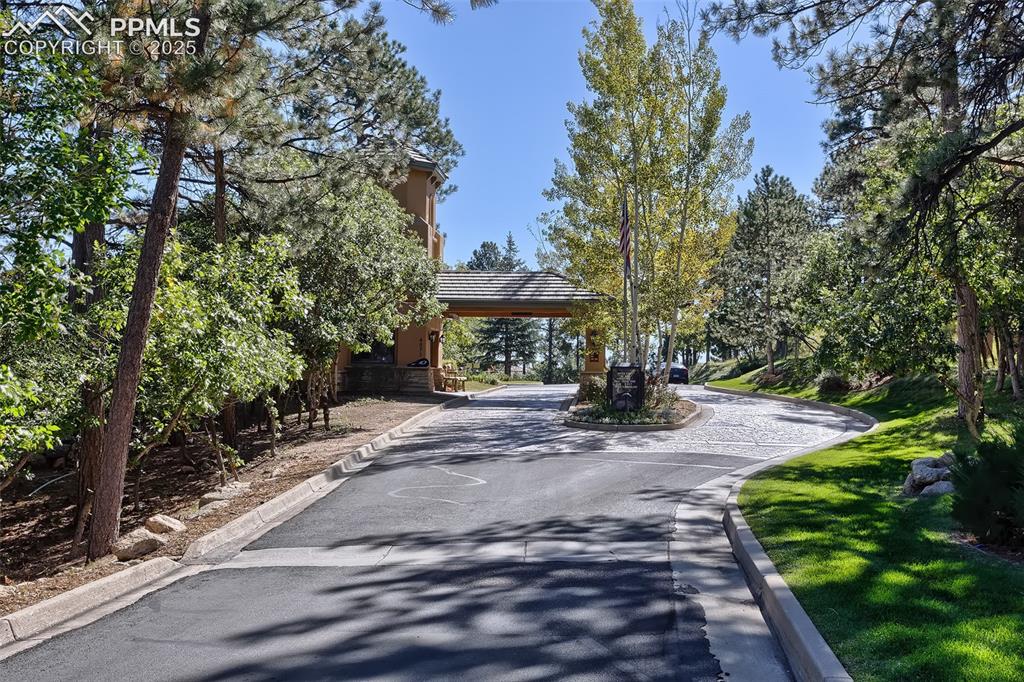 Image 10 of 16: Gated entrance to the community