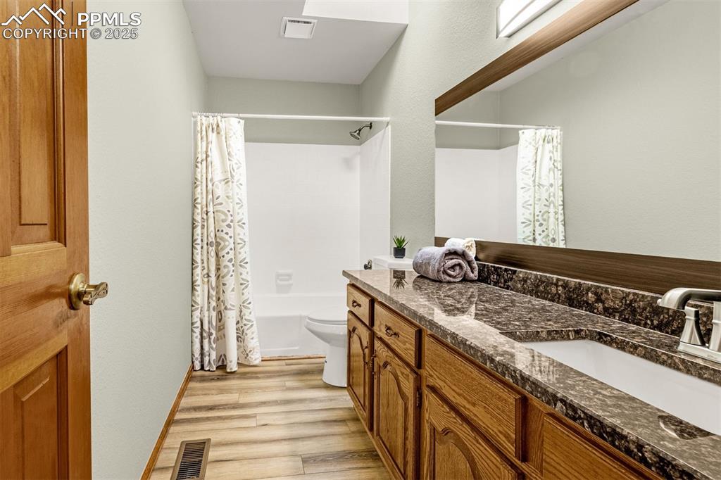 Image 6 of 26: Full bathroom upstairs with skylight