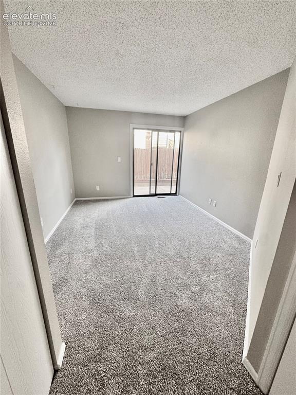 Image 11 of 20: New carpeting throughout, neutral wall tones, and a sliding glass door to a