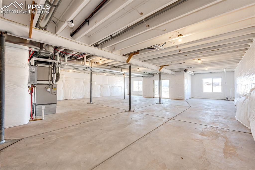 Image 26 of 39: Full Unfinished Basement with Walkout