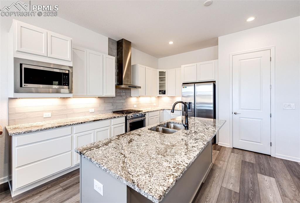 Image 8 of 39: Kitchen with Island