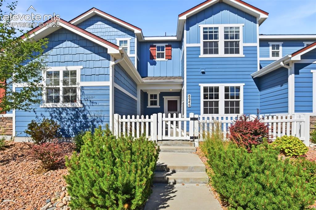 Image 1 of 45: Landscaped front entry.