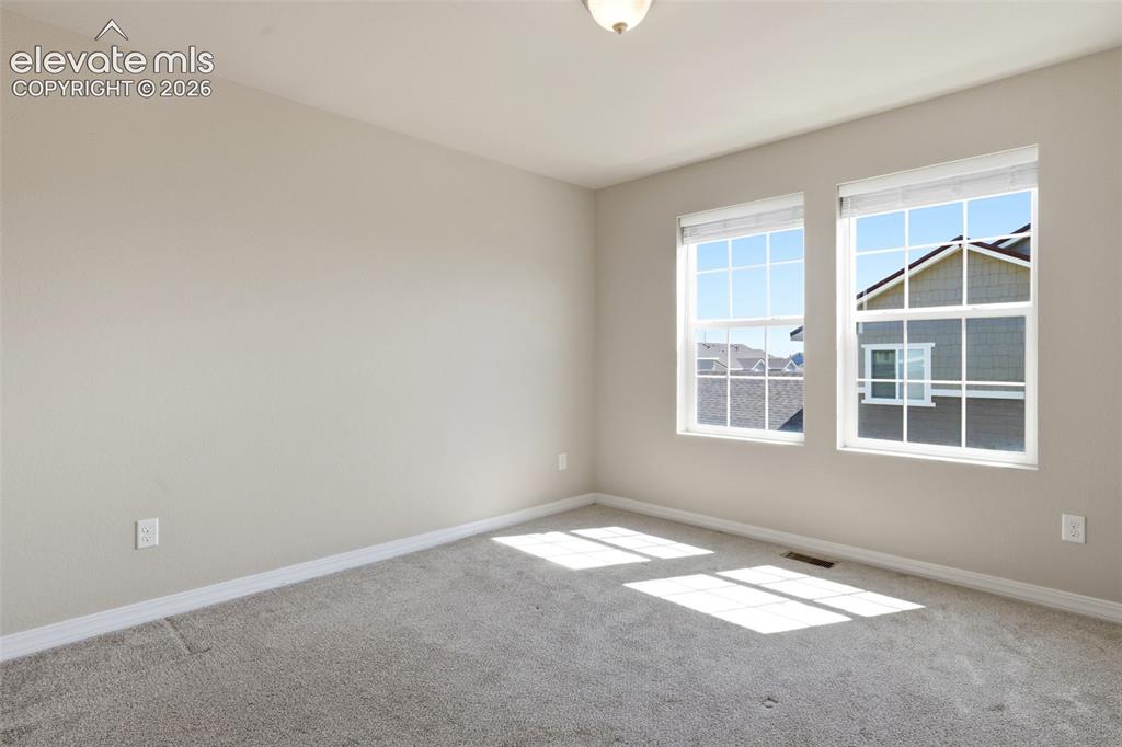 Image 33 of 45: Primary Bedroom with lots of natural lighting.