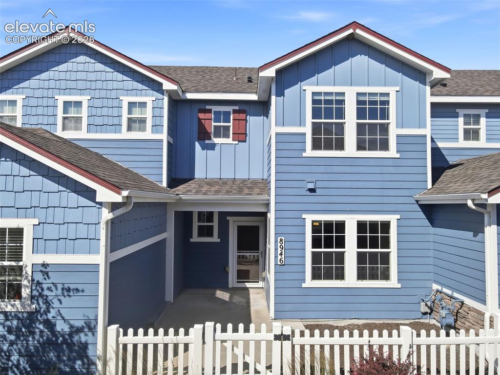 Image 4 of 45: Blue exterior with mixed siding, horizontal, and vertical paneling.