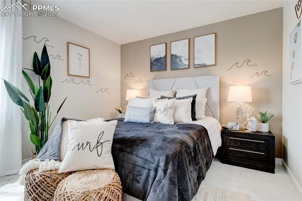 Image 4 of 32: Bedroom featuring baseboards and carpet floors