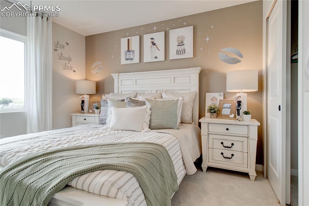 Image 5 of 32: Bedroom with carpet