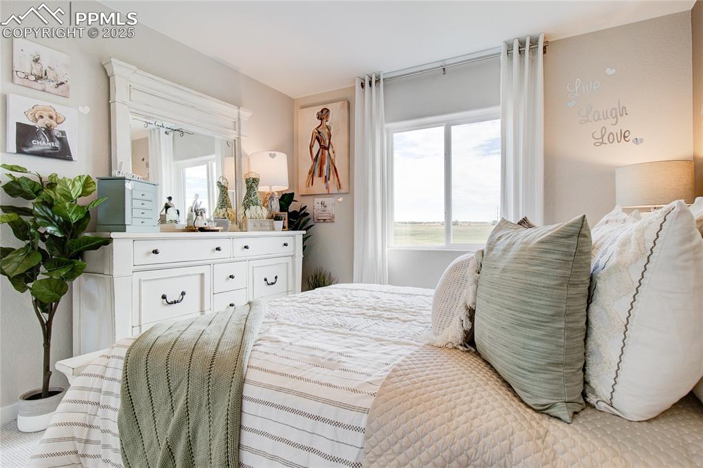 Image 6 of 32: Bedroom with multiple windows