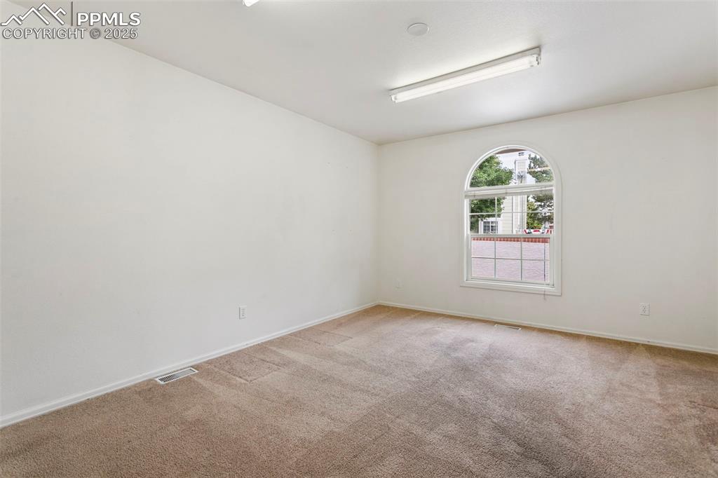 Image 19 of 38: Spacious Main Level Guest Bedroom!