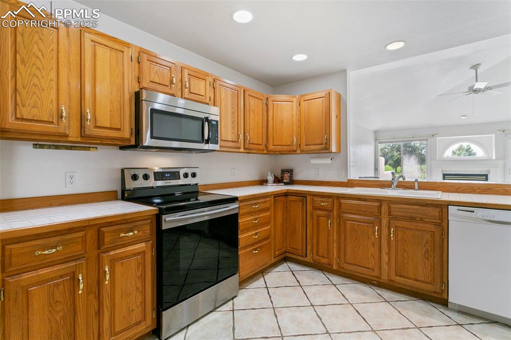 Image 5 of 38: Oak Cabinets and Tons of Counter Space!
