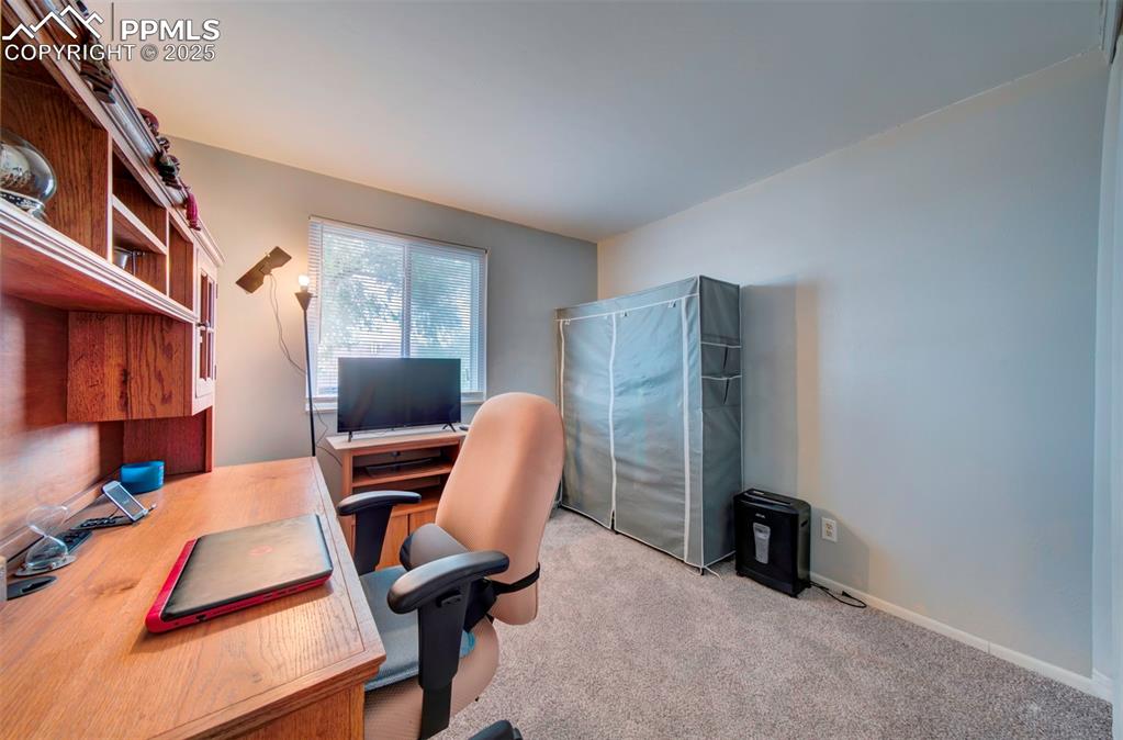 Image 15 of 36: Bedroom 2 currently used as office space