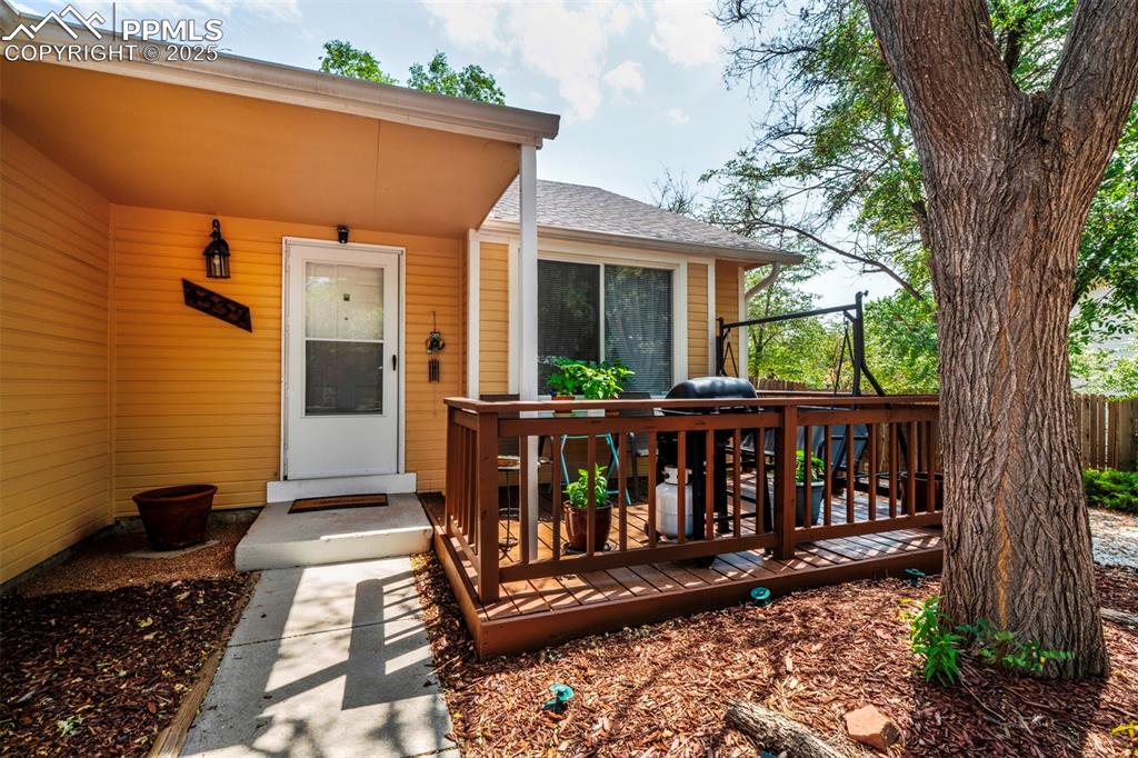 Image 2 of 36: covered front porch with the deck right next to it! 