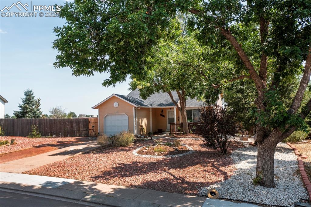 Image 28 of 36: front zeroscaped with plenty of room for extra parking. 