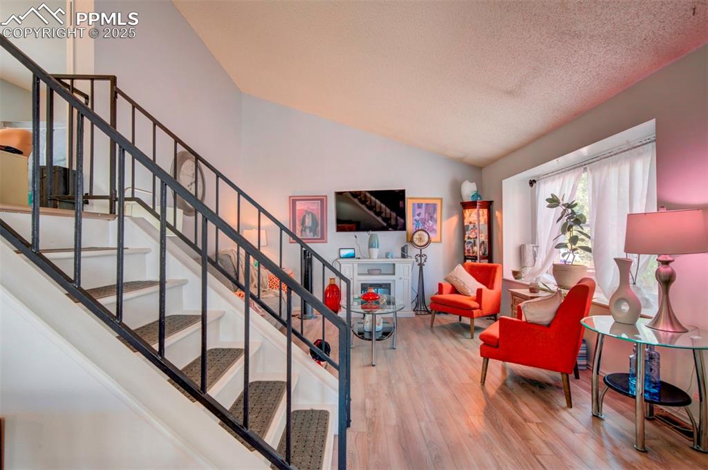 Image 3 of 36: Livingroom with vaulted ceiling