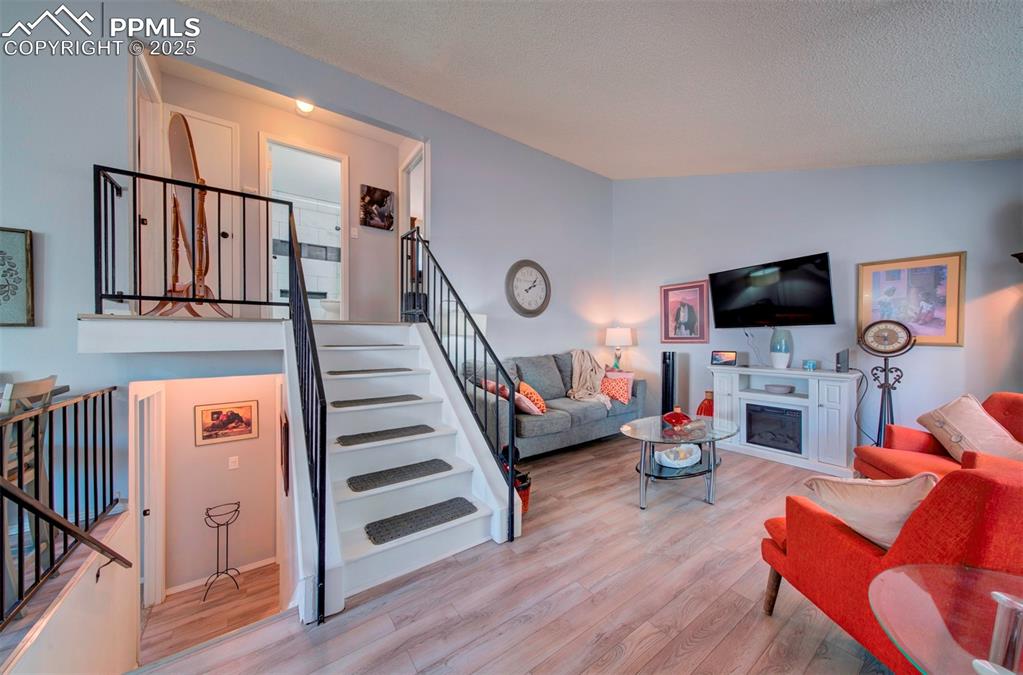 Image 4 of 36: from entry stairs to upper level and stairs to lower level